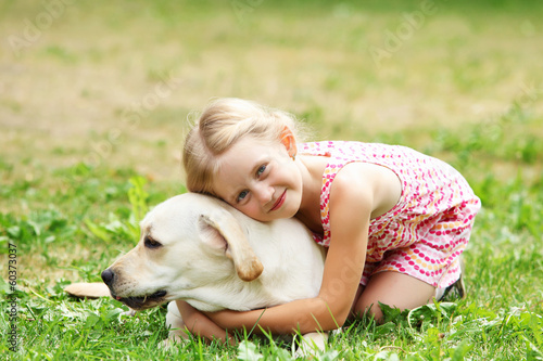 Photo: little girl with her dog little girl with her dog