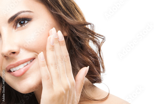 Photo: Woman touching skin or applying cream, isolated Woman touching skin or applying cream, isolated