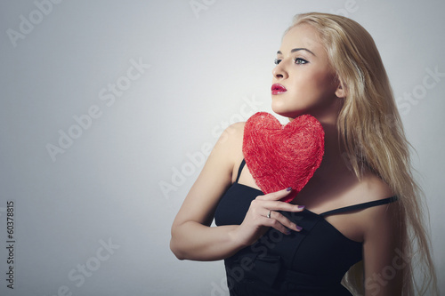 Photo: Beautiful Blond Woman with Red Heart.Love Symbol.Valentine's Beautiful Blond Woman with Red Heart.Love Symbol.Valentine's