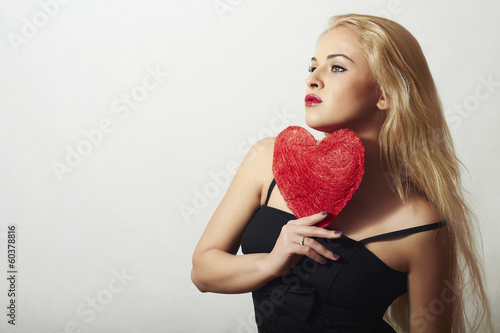 Photo: Lovely Beautiful Blond Woman with Red Heart. Valentine's Day Lovely Beautiful Blond Woman with Red Heart. Valentine's Day
