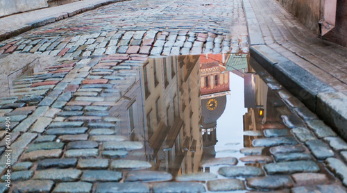 Photo: Cathedral reflection in a pool on a cobblestone road, Riga Cathedral reflection in a pool on a cobblestone road, Riga