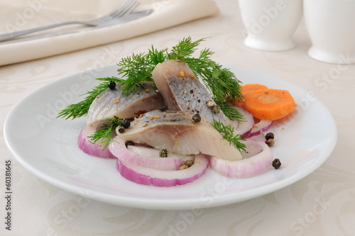 Photo: Slices of salted herring with onions and spices Slices of salted herring with onions and spices