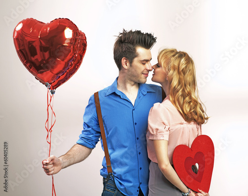 Photo: Attractive young couple during valentine's day Attractive young couple during valentine's day