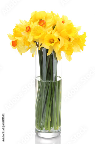 Photo: beautiful yellow daffodils in transparent vase isolated on beautiful yellow daffodils in transparent vase isolated on