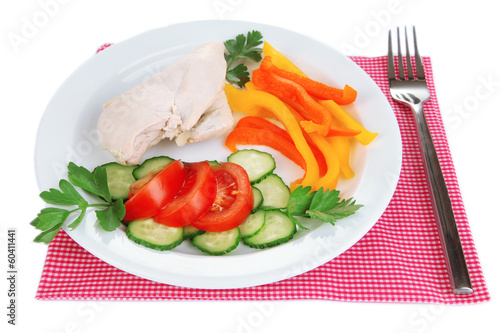 Photo: Boiled chicken breast on plate with vegetables close up Boiled chicken breast on plate with vegetables close up
