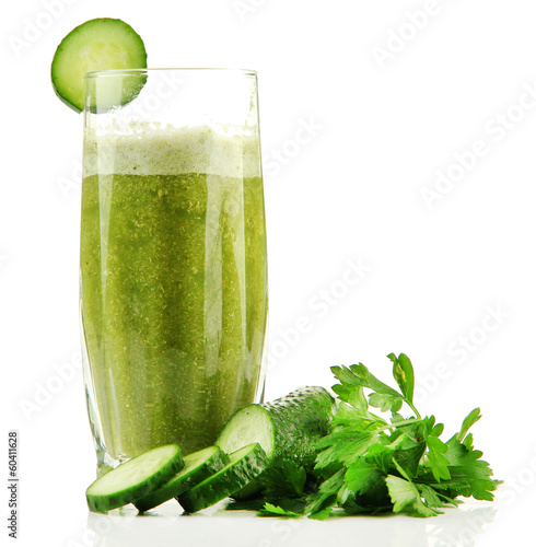 Photo: Glass of green vegetable juice and cucumber isolated on white Glass of green vegetable juice and cucumber isolated on white