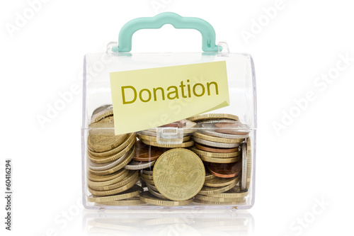 Photo: Glass bank for tips with money Glass bank for tips with money