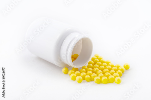 Photo: Prescription spilled, pills yellow vitamiins Prescription spilled, pills yellow vitamiins