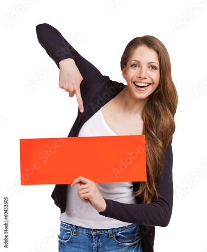 Photo: Pretty girl shows a poster Pretty girl shows a poster