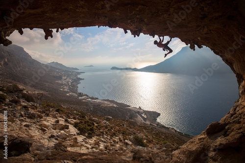 Fototapeta Silhouette of a rock climber at sunset, Kalymnos, Greece