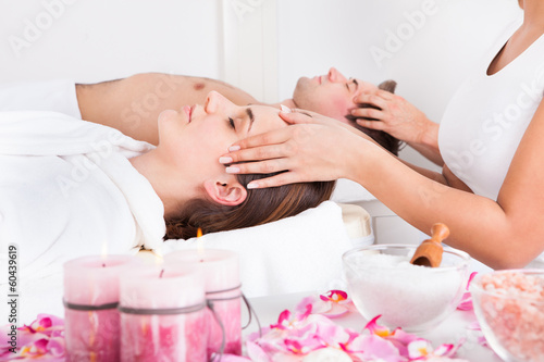 Photo: Young Couple Enjoying Massage Young Couple Enjoying Massage