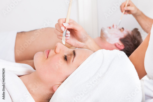 Photo: Couple Applying Facial Mask Couple Applying Facial Mask