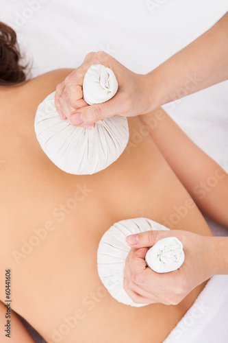 Photo: Person Getting Herbal Therapy Person Getting Herbal Therapy