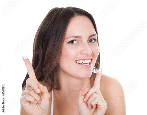 Photo: Woman With Moisturizer Cream On Finger Woman With Moisturizer Cream On Finger