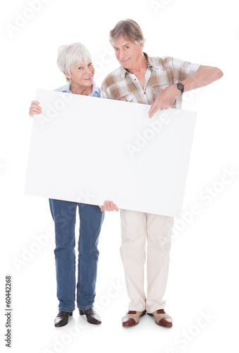 Photo: Senior Couple With White Board Senior Couple With White Board