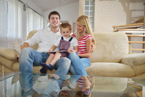 Photo: family at home using tablet computer family at home using tablet computer