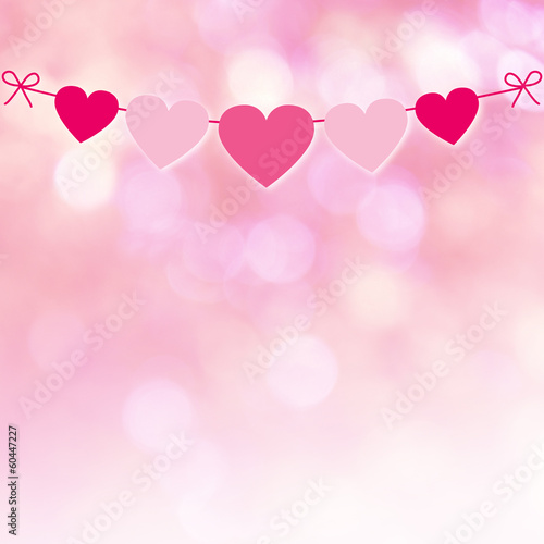 Photo: herzchengirlande vor rosa bokeh herzchengirlande vor rosa bokeh