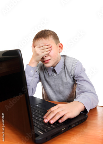 Photo: Sad Kid with Laptop Sad Kid with Laptop