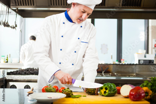 Photo: Chef cooking in his kitchen Chef cooking in his kitchen