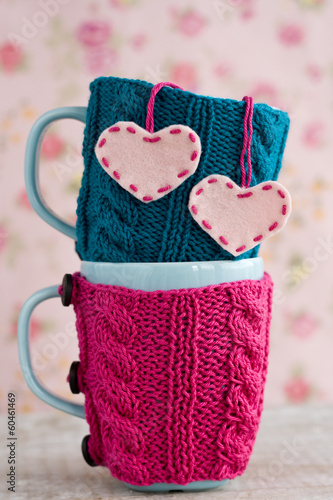Photo: Two blue cups in blue and pink sweater with felt hearts Two blue cups in blue and pink sweater with felt hearts