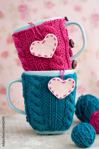 Photo: Two blue cups in blue and pink sweater with felt hearts Two blue cups in blue and pink sweater with felt hearts