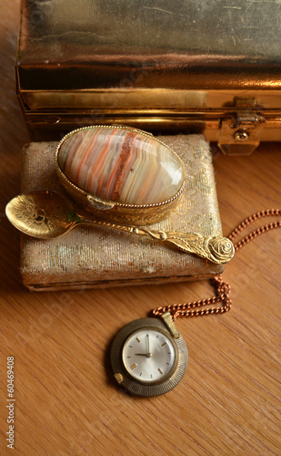 Photo: Old big golden box and vintage watch and teaspoon Old big golden box and vintage watch and teaspoon