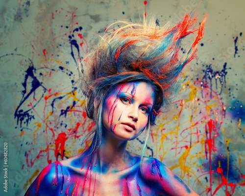Young woman muse with creative body art and hairdo
