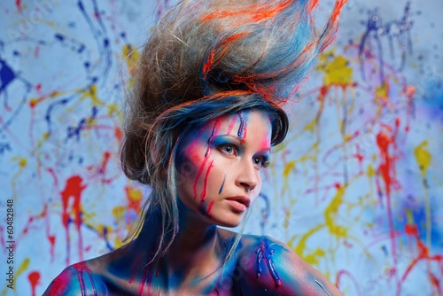 Photo: Young woman muse with creative body art and hairdo Young woman muse with creative body art and hairdo