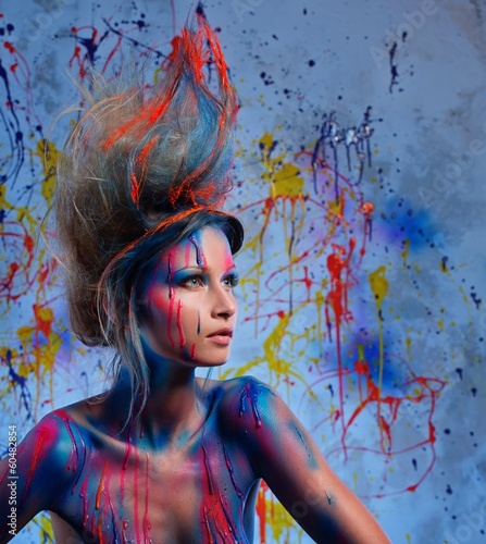 Photo: Young woman muse with creative body art and hairdo Young woman muse with creative body art and hairdo