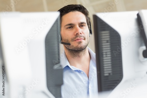 Photo: Customer service representative using computer Customer service representative using computer