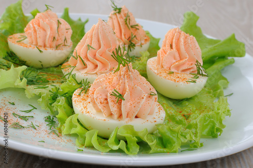 Photo: Eggs stuffed with salmon pate in lettuce leaves Eggs stuffed with salmon pate in lettuce leaves