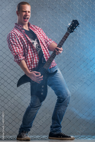 Photo: Young musician with a guitar Young musician with a guitar