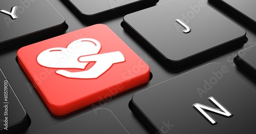 Illustration: Icon of Heart in the Hand on Red Keyboard Button. Icon of Heart in the Hand on Red Keyboard Button.
