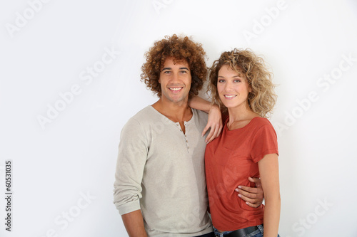 Photo: Attractive couple standing on white background Attractive couple standing on white background