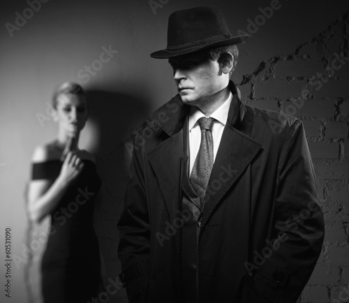 Photo: Detective man and dangerous woman with a gun Detective man and dangerous woman with a gun