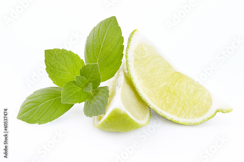 Photo: Lime segments with mint branch Lime segments with mint branch