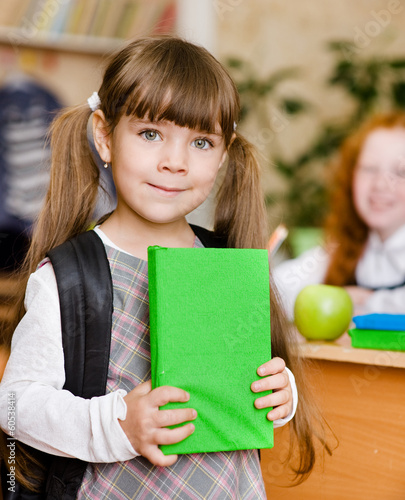 Photo: portrait of pretty preschool girl with backpack portrait of pretty preschool girl with backpack