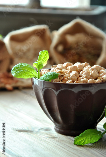 Photo: raw chickpeas in a brown bowl raw chickpeas in a brown bowl