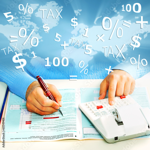 Photo: Hands of business people with calculator. Hands of business people with calculator.