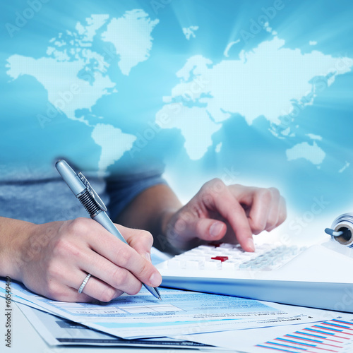 Photo: Hands of business people with calculator. Hands of business people with calculator.