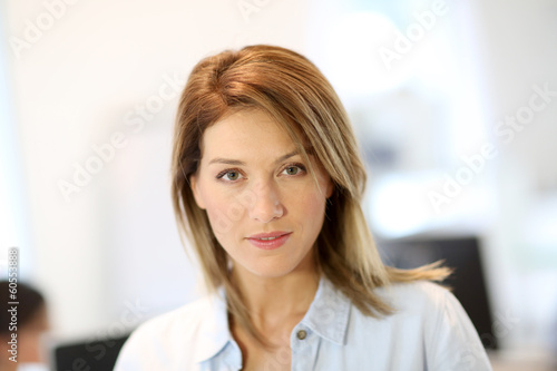 Photo: Portrait of businesswoman in office Portrait of businesswoman in office