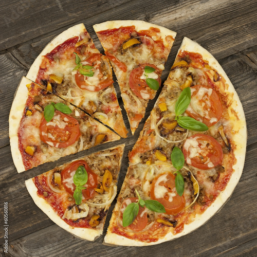 Photo: Fresh italian pizza, upper view Fresh italian pizza, upper view