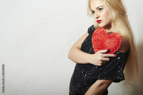 Photo: Beautiful Blond Woman with Red Heart. Girl Show Love Symbol Beautiful Blond Woman with Red Heart. Girl Show Love Symbol