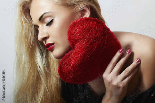 Photo: Beautiful Blond Woman with Red Heart.Love Symbol.Valentine's Beautiful Blond Woman with Red Heart.Love Symbol.Valentine's