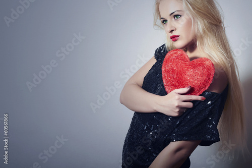 Photo: Beautiful Blond Woman with Red Heart. Girl Show Love Symbol Beautiful Blond Woman with Red Heart. Girl Show Love Symbol