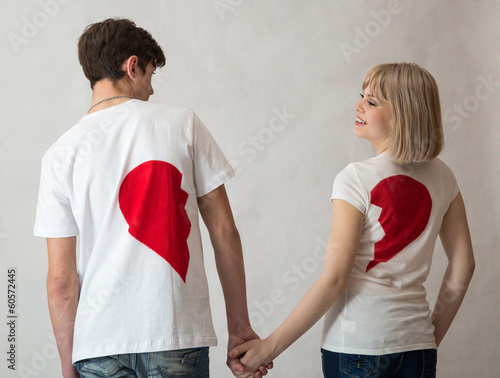 Photo: man and woman on Valentine's Day in jeans on a white background man and woman on Valentine's Day in jeans on a white background
