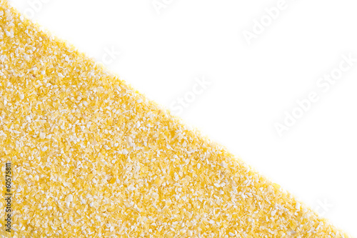Photo: Corn grits on white background Corn grits on white background