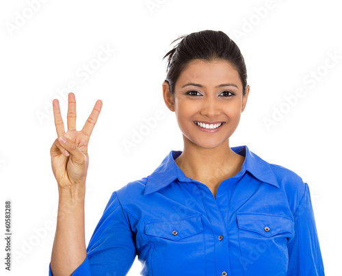 Photo: Business woman giving a three fingers sign gesture Business woman giving a three fingers sign gesture