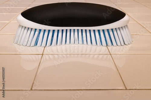 Illustration: Scrub brush and sparkling clean ceramic tile countertop Scrub brush and sparkling clean ceramic tile countertop