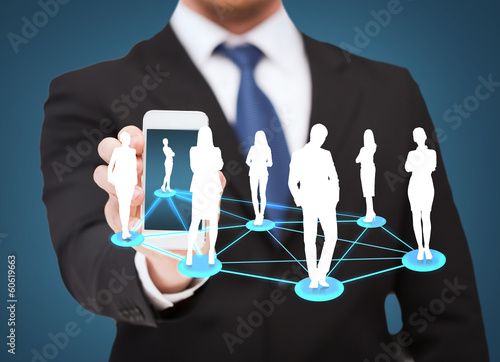 Photo: businessman showing smartphone with social network businessman showing smartphone with social network